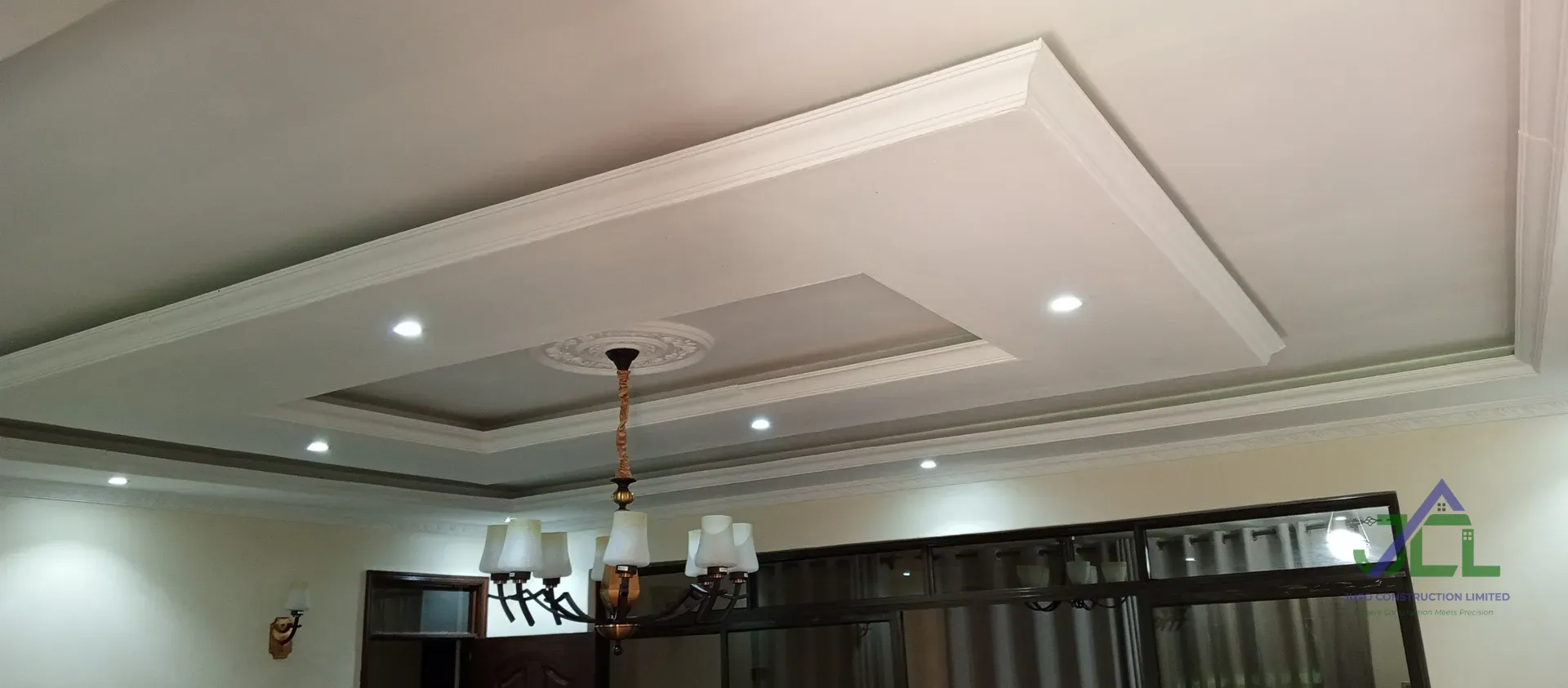 Bespoke gypsum ceiling with decorative mouldings by Jufo Construction